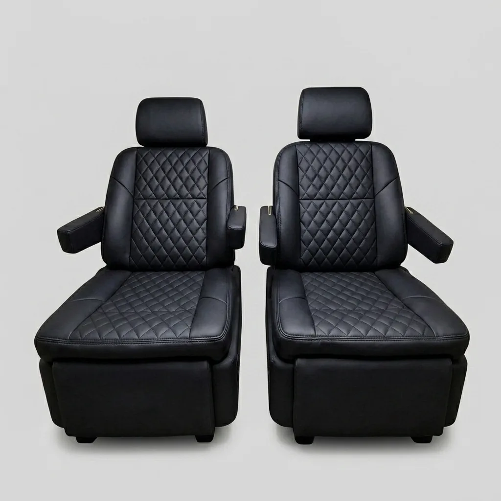 Premium black quilted leather captain's chairs reclined with footrests extended, showing electric reclining and footrest adjustment