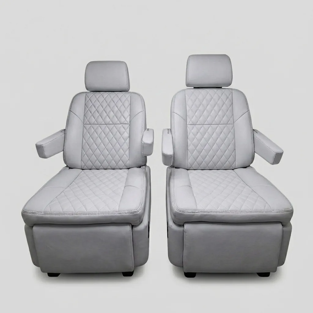 Premium light gray quilted leather captain's chairs reclined with footrests extended, showing electric reclining and footrest adjustment