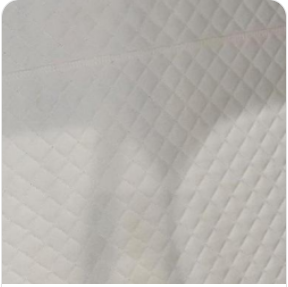 Cream quilted leather interior lining swatch